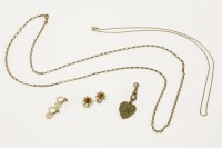 Lot 60 - An Edwardian gold heart shaped locket set with  turquoise and seed pearl (tested as 9ct gold) on a gold swivel clip