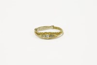 Lot 99 - An 18ct gold five stone diamond boat shaped ring