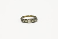 Lot 125 - A late Victorian graduated diamond carve head ring
