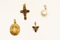 Lot 82 - A 9ct gold garnet cross