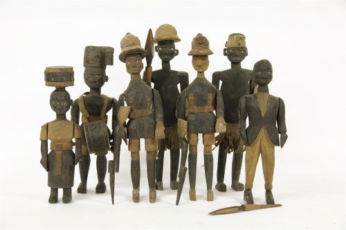 Lot 292 - Seven Askari carved wood polychrome figures