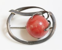 Lot 15 - An Edwardian sterling silver coral bead brooch