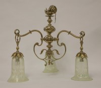 Lot 467 - An Art Nouveau brass three-branch hanging light