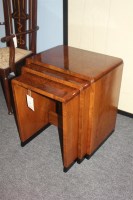 Lot 539 - A nest of three Art Deco walnut tables