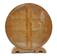 Lot 541 - An Art Deco walnut circular display cabinet
