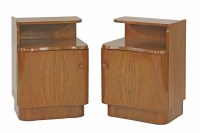 Lot 547 - A pair of walnut kidney-fronted bedside cabinets