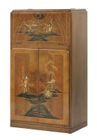 Lot 553 - A walnut cocktail cabinet