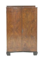 Lot 554 - A walnut serpentine tallboy