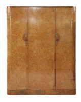 Lot 569 - An Art Deco burr maple triple wardrobe