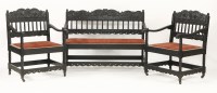 Lot 511 - A Victorian ebonised suite of two armchairs and a settee