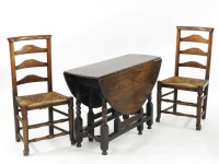 Lot 542 - A pair of rush seated ladder back chairs