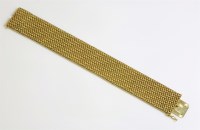 Lot 521 - A gold woven mesh link bracelet