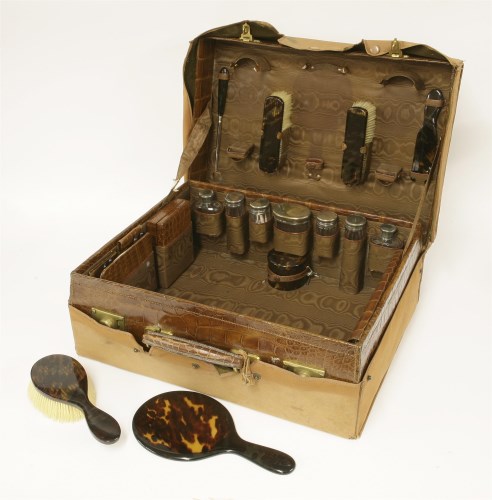 Lot 74 - A crocodile skin travelling case