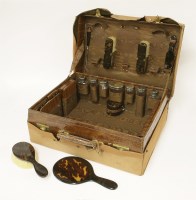 Lot 74 - A crocodile skin travelling case