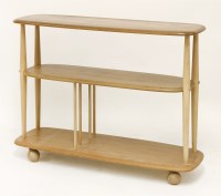 Lot 336 - An Ercol light elm three-tier open whatnot