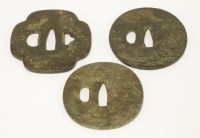 Lot 523 - Three Japanese iron tsuba