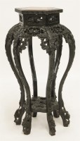 Lot 385 - A Chinese ebonised vase stand