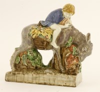 Lot 83 - A figure of a donkey eating carrots