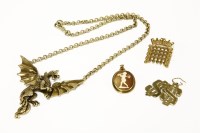 Lot 246 - A pair of 9ct gold dollar sign earrings (one fitting deficient)
