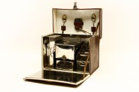 Lot 328 - An Edwardian leather cased picnic metal set