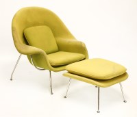 Lot 527 - A womb chair and ottoman