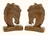 Lot 192 - A pair of carved wood horse head bookends