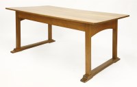 Lot 74 - An Arts and Crafts oak dining table