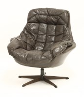 Lot 464 - A brown leather 'bucket' chair