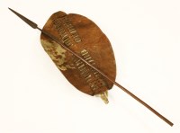 Lot 87 - A Zulu hide war shield and assegai