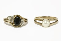 Lot 19 - A 9ct gold single stone sapphire ring with diamond set shoulders