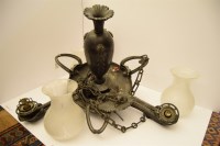 Lot 243 - An Art Nouveau design cast metal three branch chandelier