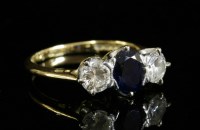 Lot 347 - An 18ct gold three stone sapphire and diamond ring