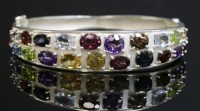 Lot 277 - A silver gem set hinged bangle
