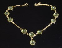 Lot 260 - A gold peridot bracelet