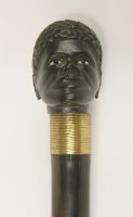 Lot 83 - An ebonised walking stick