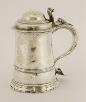 Lot 492 - A George II plain lidded tankard