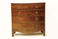 Lot 1745 - A George III bowfronted mahogany chest of two short above three long on swept feet