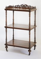 Lot 131 - A Victorian walnut three-tier whatnot