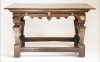 Lot 84 - A Continental oak serving table