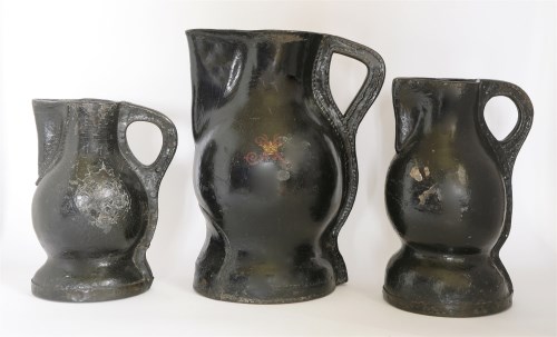 Lot 103 - A matched set of three graduated 'Black Jack' leather jugs