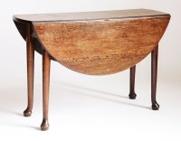 Lot 187 - An oval oak drop-leaf table