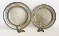 Lot 195 - A squat pedestal pewter candlestick