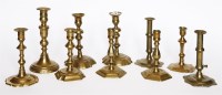 Lot 136 - A pair of brass ejector candlesticks