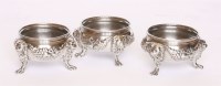 Lot 221 - A set of three George II silver salt cellars