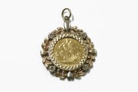 Lot 1057 - A 1900 half sovereign claw set in a 9ct three colour gold mount