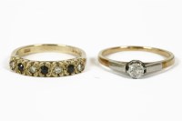 Lot 1044 - A 9ct gold seven stone sapphire and diamond ring