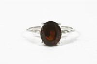 Lot 1060 - A 9ct white gold single stone oval cut garnet ring