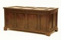 Lot 1625 - An oak four panel coffer
