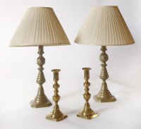 Lot 34 - A pair of brass ejector candlesticks