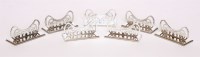 Lot 237 - A set of forty-eight Elizabeth II silver place card holders